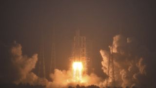 In this photo by China's Xinhua News Agency, a Long March-5 rocket, carrying the Chang'e-6 spacecraft, blasts off from its launchpad at the Wenchang Space Launch Site.