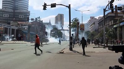 Protesters running through tear gas in streets of Nairobi