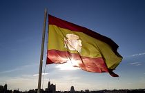 Archivo: Una bandera española ondea sobre el horizonte de Madrid, el lunes 2 de julio de 2012. 