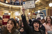 Students and supporters gather in the rotunda to protest gun violence during the opening day of the Iowa Legislature.