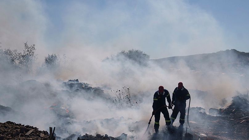 Firefighters try to extinguish a blaze in Greece earlier this month.