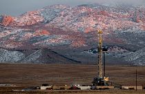 A drill rig stands at a Fervo Energy geothermal site under construction near Milford, Utah, 26 November 2023. 
