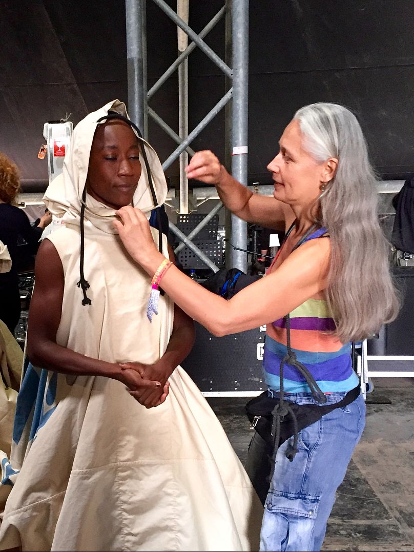 Storey with Malian singer Rokia Traoré, Glastonbury Festival 2016, wearing the world’s first digital couture dress dedicated to exploring climate change and its human impact