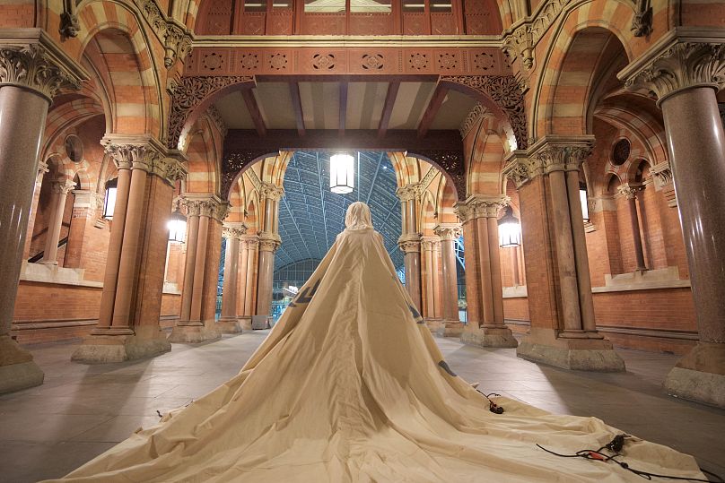 'Dress For Our Time', here at St Pancras station, was created out of a decommissioned UNHCR tent that once housed a family of displaced people at Zaatari Camp in Jordan