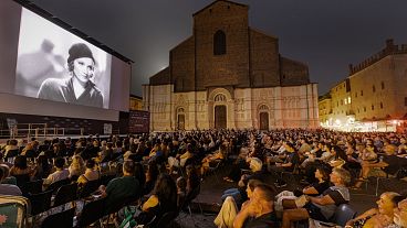 Crowds on Bologna's Piazza Maggiore enjoy an outdoor screening of 'Morocco' 