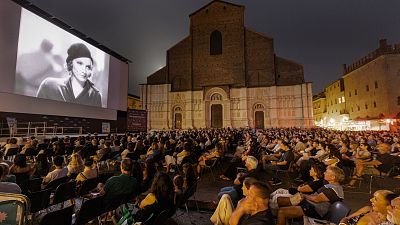 Crowds on Bologna's Piazza Maggiore enjoy an outdoor screening of 'Morocco' 