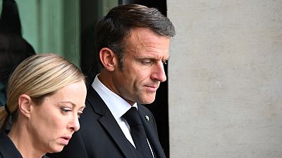 France's President Emmanuel Macron arrives with Italy's Prime Minister, Giorgia Meloni prior a meeting at the Palazzo Chigi in Rome, 26 September 2023