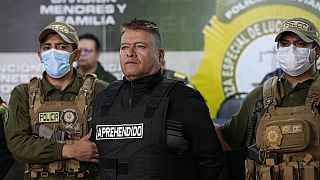 Bolivian police hold the detained Juan Jose Zuniga, former general commander of the Army, in La Paz, Bolivia on Wednesday