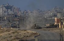 Israeli army tanks are seen in Wadi Gaza, central Gaza Strip, Wednesday, June 26, 2024. (AP Photo/Abdel Kareem Hana)