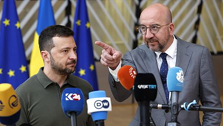 Ukraine's President Volodymyr Zelenskyy and European Council President Charles Michel speak with the media as they arrive for an EU summit in Brussels, 27 June 2024