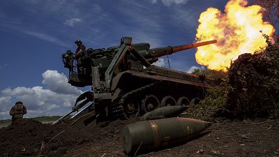 Ukrainian soldiers of 43rd artillery brigade fire by 2s7 self-propelled howitzer towards Russian positions at the frontline in Donetsk region, Ukraine, Monday, June 24, 2024. 