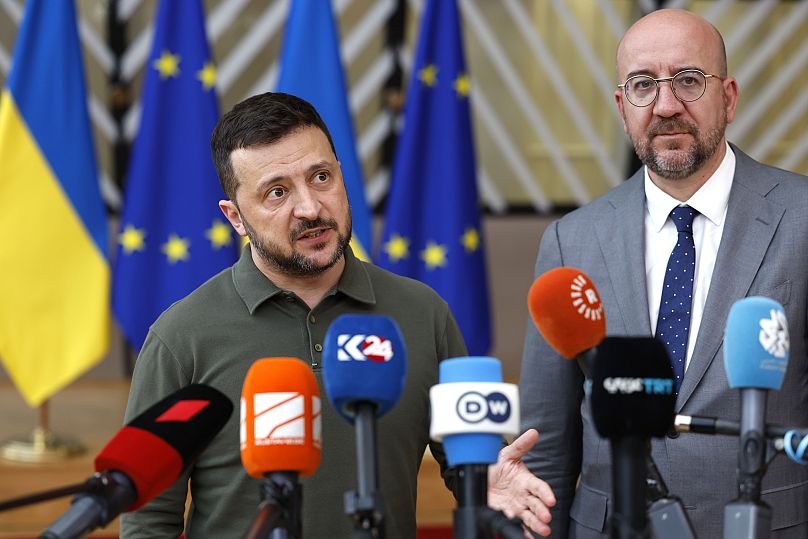 Ukraine's President Volodymyr Zelenskyy and European Council President Charles Michel speak with the media as they arrive for an EU summit in Brussels.