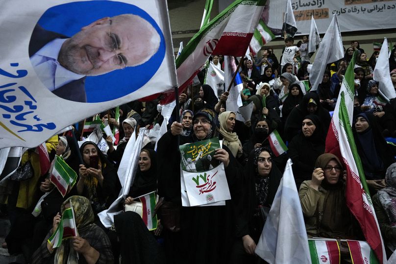 Supporters of Iran's parliament speaker Mohammad Bagher Qalibaf, the most prominent hard-line candidate for the presidential election, attend his campaign gathering in Tehran.