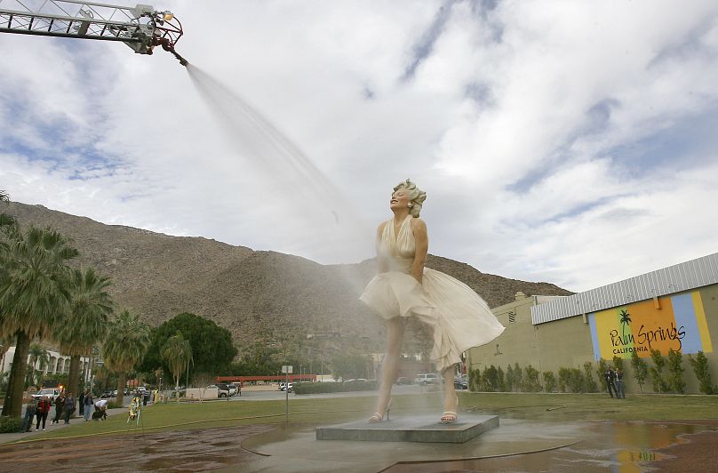 The "Forever Marilyn" sculpture gets a shower from the Palm Springs Fire Department