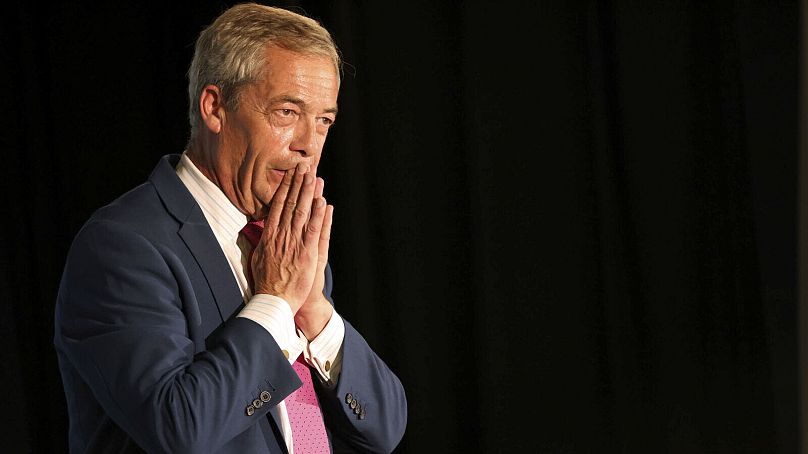 Reform UK Leader Nigel Farage gestures during a meeting while on the general election campaign trail, in Boston, England, Thursday June 27, 2024.