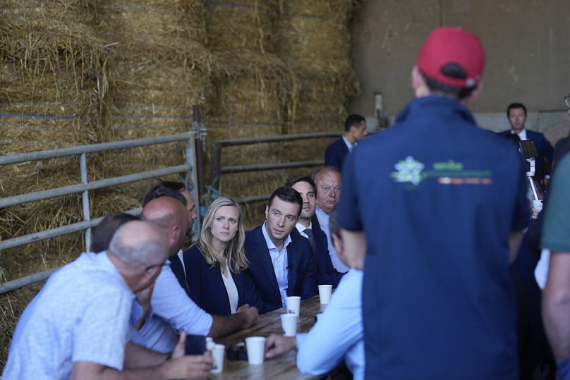 Far-right National Rally leader Jordan Bardella meets farmers as he visits a farm in Chuelles, 137 kms (85 miles) south of Paris, 14 June 2024