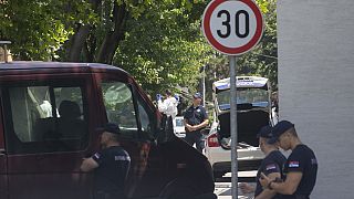 Police officers work at a crime scene close to the Israeli embassy in Belgrade, Serbia, Saturday, June 29, 2024.