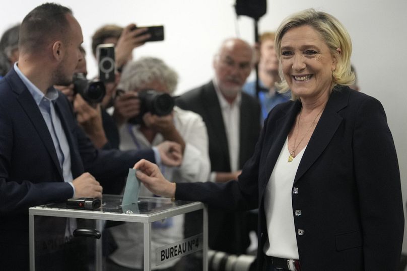 French far right leader Marine Le Pen casts her ballot for the first round of the parliamentary election, Sunday, June 30, 2024 in Henin-Beaumont, northern France. 