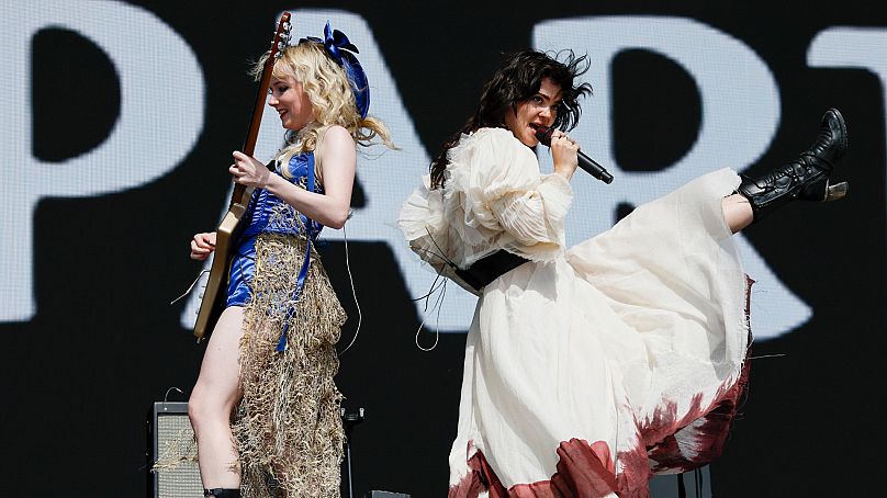 Emily Roberts, left, and Abigail Morris of the rock band 'The Last Dinner Party' perform during the Glastonbury Festival in Worthy Farm, Somerset, England, Saturday, June 29, 
