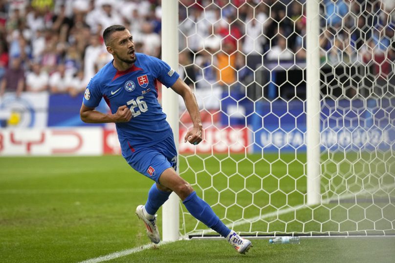 Slovakia's Ivan Schranz celebrates after scoring his side's opening goal during a round of sixteen match between England and Slovakia at Euro 2024