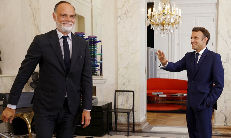 French President Emmanuel Macron, right, accompanies Edouard Philippe, former French Prime Minister and head of Horizons political party in 2022