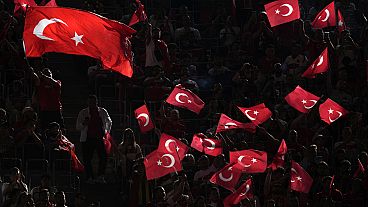 Turkey fans cheer and wave flags before a Group F match between Turkey and Portugal at the Euro 2024 soccer tournament in Dortmund, Germany, Saturday, June 22, 2024. (AP Photo