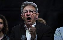 Far-left leader Jean-Luc Melenchon speaks at Republique square during a protest against the far-right National Rally