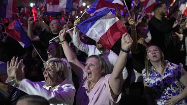 Supporters of French far right leader Marine Le Pen react on hopes of her victory Sunday, 30 June 2024