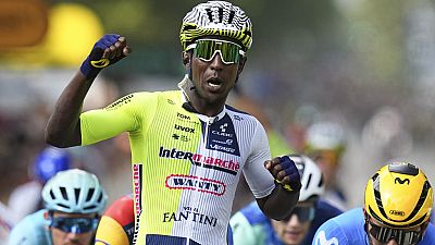 Eritrea's Biniam Girmay celebrates winning ahead of Colombia's Fernado Gavira, right, during the third stage of the Tour de France cycling race over 230.8 kilometers