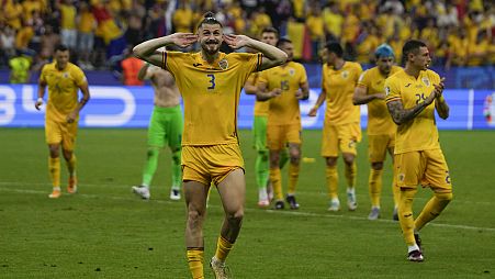 Romania's Radu Dragusin celebrates at the end of Group E match at the Euro 2024 football tournament against Slovakia in Frankfurt, Germany, Wednesday, June 26, 2024