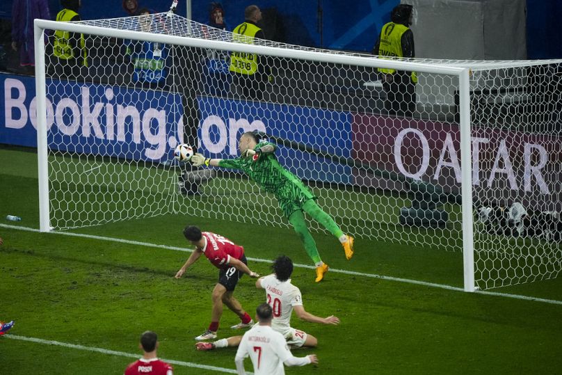 Mert Günok's stunning save in stoppage time against Austria defended the 2-1 lead