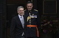 Incoming Prime Minister Dick Schoof, left, arrives at the royal palace to be sworn in by Dutch King Willem-Alexander in The Hague, Netherlands, Tuesday, July 2, 2024.