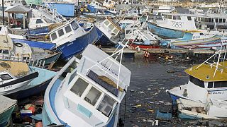 Fishing vessels damaged by Hurricane Beryl sit upended at the Bridgetown Fisheries in Barbados.