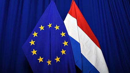Флаги ЕС и Нидерландов