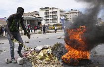 Anti-tax protesters in Nairobi clashed with riot police on Tuesday, blocking roads and burning tires after recent tax legislation caused deadly unrest.