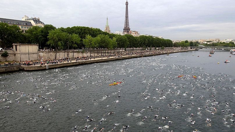 Competitors swim in the Seine River during the Paris Triathlon in July 2011.