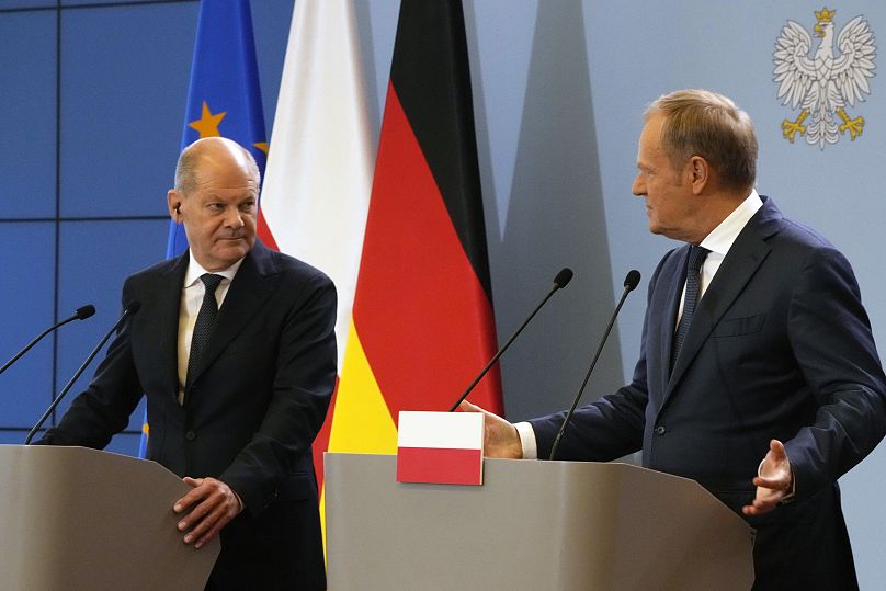 German Chancellor Olaf Scholz and Polish Prime Minister Donald Tusk attend a press conference in Warsaw.