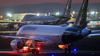 Lufthansa aircrafts are parked at the airport in Frankfurt, Germany, Wednesday, March 18, 2020.