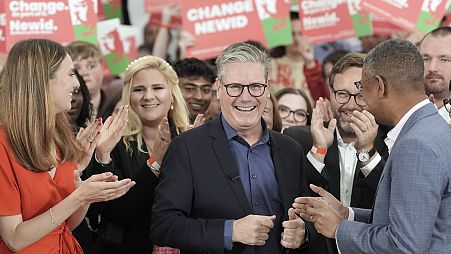 Labour Party leader Keir Starmer, center, arrives with First Minister of Wales Vaughan Gething, right, for a visit to the West Regwm Farm Events Venue in Carmarthenshire