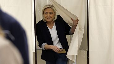French far-right leader Marine Le Pen exits the voting booth before voting for the European elections, 9 June 2024