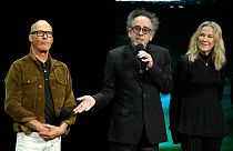 Tim Burton, centre, director of "Beetlejuice Beetlejuice," discusses the film alongside actors Michael Keaton, left, and Catherine O'Hara at CinemaCon in Las Vegas