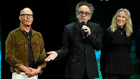 Tim Burton, centre, director of "Beetlejuice Beetlejuice," discusses the film alongside actors Michael Keaton, left, and Catherine O'Hara at CinemaCon in Las Vegas