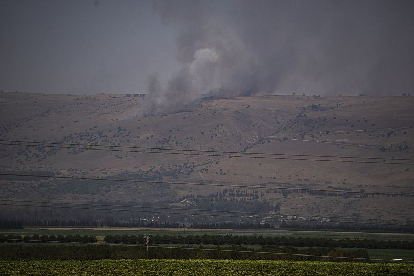 Smoke rises to the sky as a fire burns an area after a Lebanese shelling, in the Israeli-controlled Golan Heights.