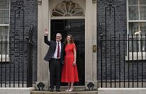 Britain's Labour Party Prime Minister Keir Starmer and his wife Victoria waves to the crowds of supporters and media from the doorstep of 10 Downing Street in London, Friday, 