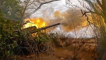 Russian soldiers fire from their 152-mm «Giatsint-B» howitzer from their position at Ukrainian troops at an undisclosed location in Ukraine.