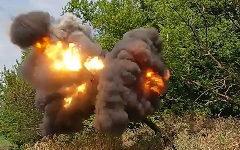 Russian soldiers fire from their 152-mm «Giatsint-B» howitzer from their position at Ukrainian troops at an undisclosed location in Ukraine.