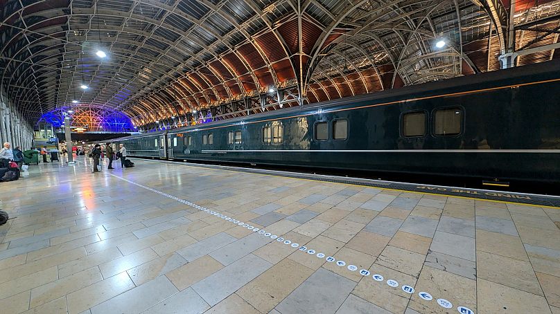 The train has both standard passenger cars and sleeper cabins. 