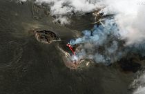 This colour infrared image released by Maxar Technologies shows lava flowing from the Mount Etna volcano erupting, in Sicily, Italy on Thursday