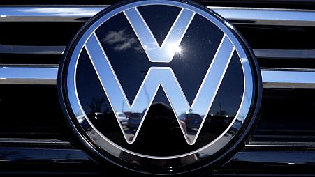 Volkswagen logo is seen at a new and used vehicles dealership in Palatine, Ill., Tuesday, March 20, 2024. (AP Photo/Nam Y. Huh)
