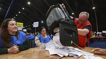 A ballot box is emptied at the Titanic Exhibition Centre, in Belfast, Northern Ireland, during the count for the 2024 General Election, Thursday, July 4, 2024